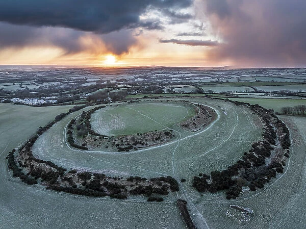 Aerial view of winter sunrise above Warbstow Bury, an Iron Age Hillfort near Davidstow in Cornwall, England