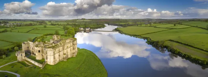 Framed Print : Aerial vista of Carew Castle in Pembrokeshire Coast National Park, Wales, UK Framed Print : Aerial vista of Carew Castle in Pembrokeshire Coast National Park, Wales, UK