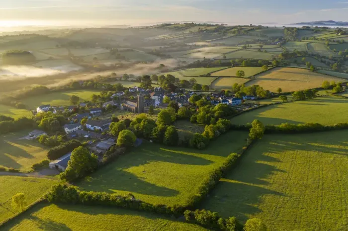 Framed Print : Aerial vista of the Dartmoor village of South Tawton at dawn, Devon, England