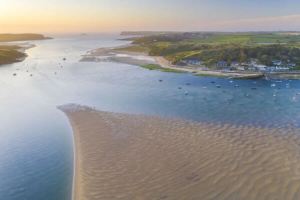 Aerial vista of sunset over the Camel Estuary and Rock, Cornwall. England