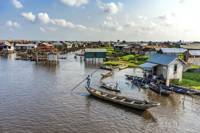 Framed Print : Africa, Benin, Ganvie. a scene on the main channel with boats, shops and stilt houses Framed Print : Africa, Benin, Ganvie. a scene on the main channel with boats, shops and stilt houses
