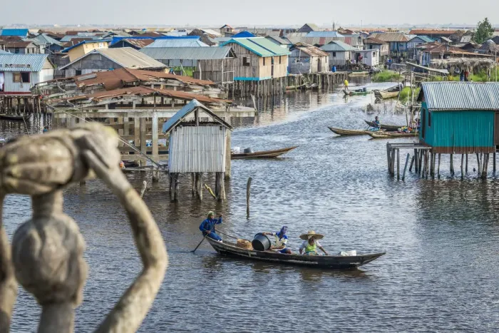 Framed Print : Africa, Benin, Ganvie. View over the channel with stilt houses and canoes Framed Print : Africa, Benin, Ganvie. View over the channel with stilt houses and canoes