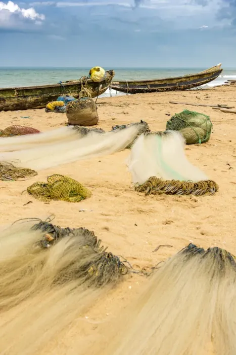 Framed Print : Africa, Benin, Grand Popo, folded fishing nets and boats on the sandy beach Framed Print : Africa, Benin, Grand Popo, folded fishing nets and boats on the sandy beach