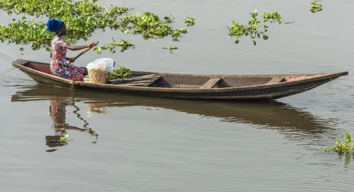Framed Print : Africa, Benin, Lake Nokoua. A woman on the way to the market in the famous stilt