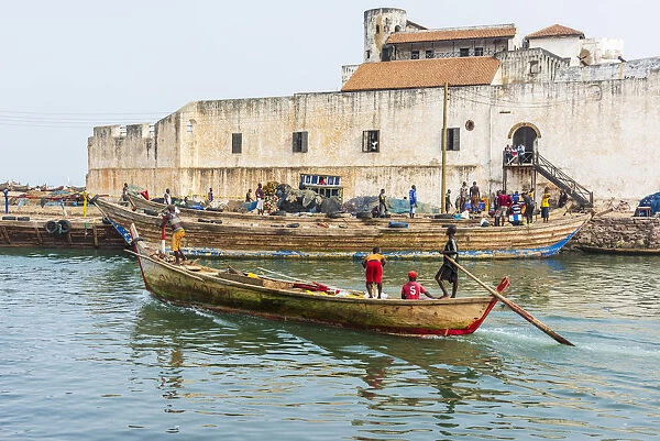 Africa, Ghana, Elmina harbour. Traditional wooden fishing boats in the harbour in