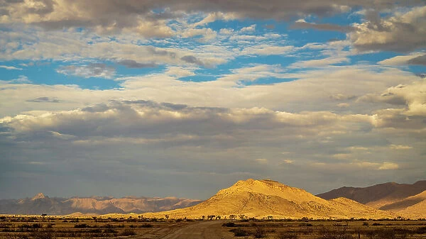 Africa, Namibia. Namib Naukluft area. A beautifully lit mountain range near Solitaire
