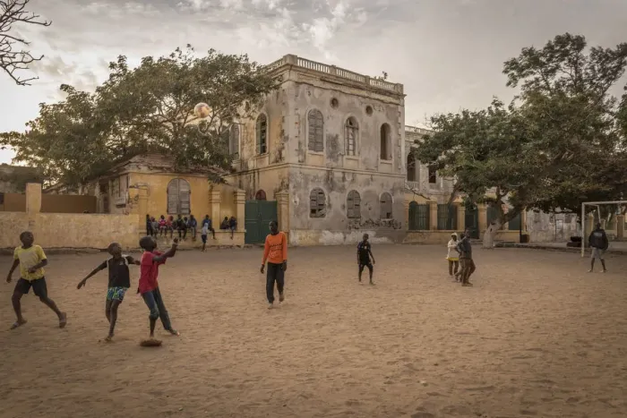 Framed Print : Africa, Senegal, Dakar. children playing football at sunset on the island Gora e Framed Print : Africa, Senegal, Dakar. children playing football at sunset on the island Gora e