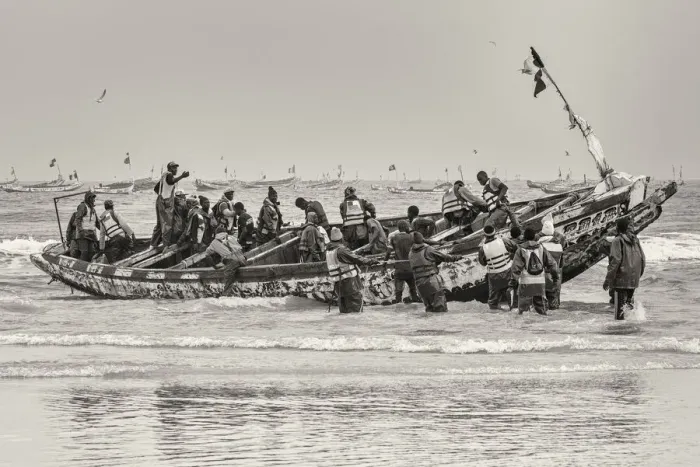 Framed Print : Africa, Senegal, Kayar. Fishermen with their boat going out Framed Print : Africa, Senegal, Kayar. Fishermen with their boat going out