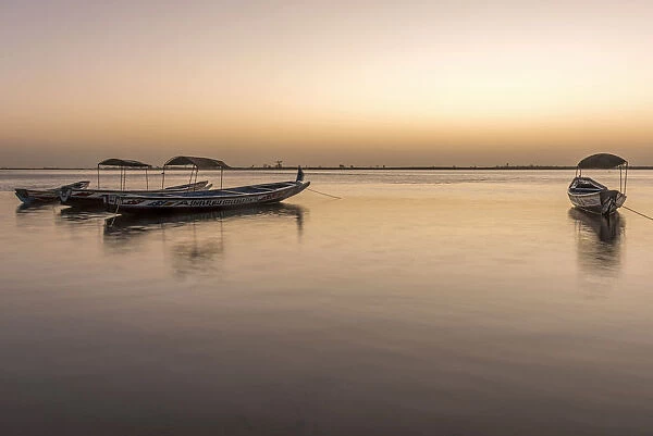 Africa, Senegal, Sine-Saloum-Delta. Fishing boats at sunrise