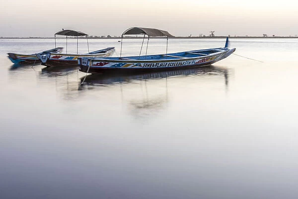 Africa, Senegal, Sine-Saloum-Delta. Fishing boats at sunrise