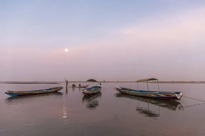 Framed Print : Africa, Senegal, Sine-Saloum-Delta. Moon rising above fishing boats in the delta Framed Print : Africa, Senegal, Sine-Saloum-Delta. Moon rising above fishing boats in the delta