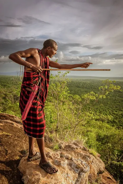Framed Print : Africa, Tanzania, Manyara Region. Msai man on a rock overlooking the landscape towards the plain of Tarangire National park Framed Print : Africa, Tanzania, Manyara Region. Msai man on a rock overlooking the landscape towards the plain of Tarangire National park