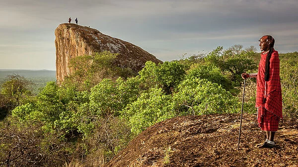Africa, Tanzania, Manyara Region. Msai men on caracteristic rocks watching the landscape