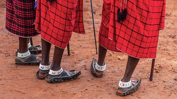 Africa, Tanzania, Manyara Region. Close up of Msai feet with their typical shoes made of motorcycle tyre