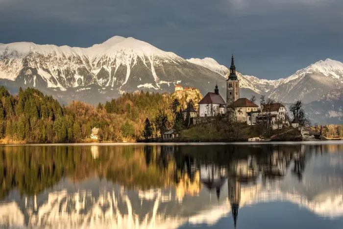 Framed Print : Afternoon sunlight over Church of the Assumption of Mary, Lake Bled, Upper Carniola