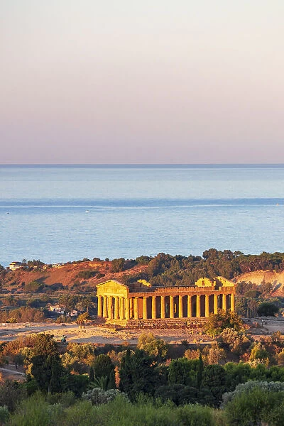 Agrigento, Sicily. Concordia Temple in the Valley of Temples at sunrise with the sea in