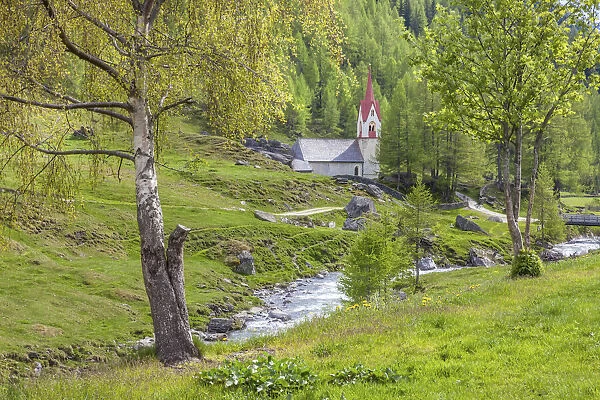 The Ahr stream at the Holy Spirit church, Valle Aurina, South Tyrol, Italy