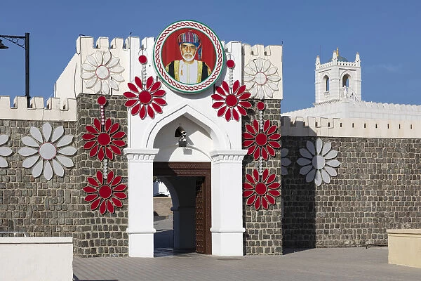Al Alam Palace decorated with flowers and a picture of Sultan Qaboos, Muscat, Oman