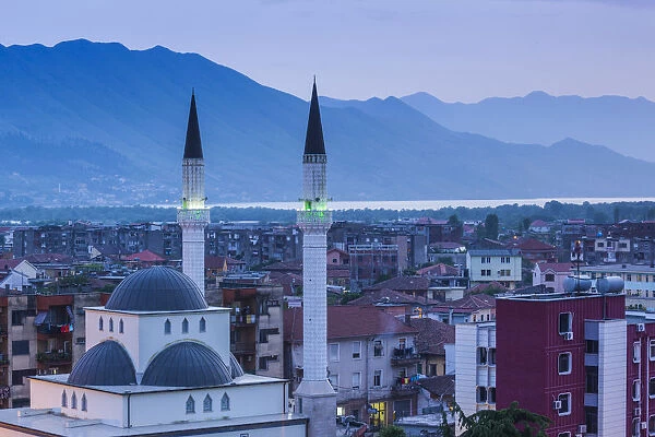 Albania, Shkodra, elevated view of Zogu 1 Boulevard and mosque, dusk