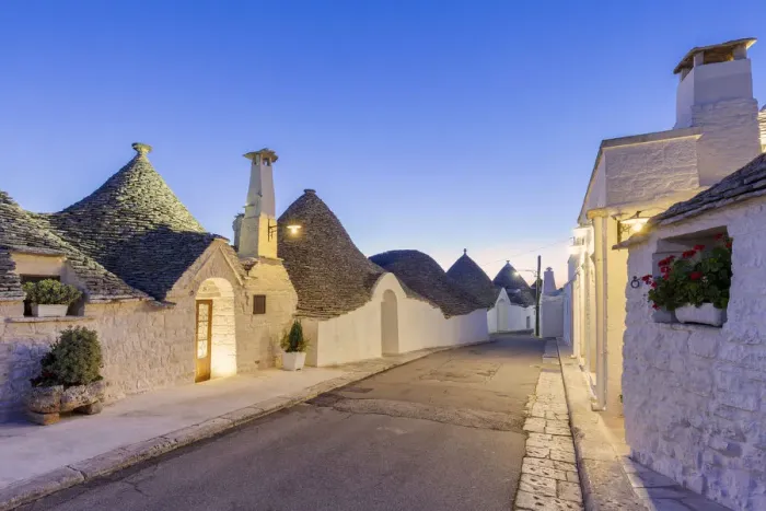 Framed Print : Alley between white trulli houses at dusk. Unesco World Heritage Site, Alberobello Framed Print : Alley between white trulli houses at dusk. Unesco World Heritage Site, Alberobello