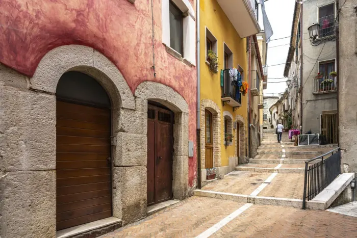 Framed Print : Alleys in the historic center of Campobasso with colored facades and brick paving