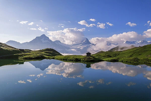 Alpine peaks reflecting in the water of the lake of Bachalpsee, Grindelwald, Bernese Oberland, Switzerland