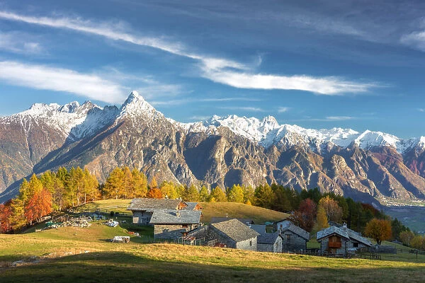 Alpine village of Cermine with view on snowcapped mountains