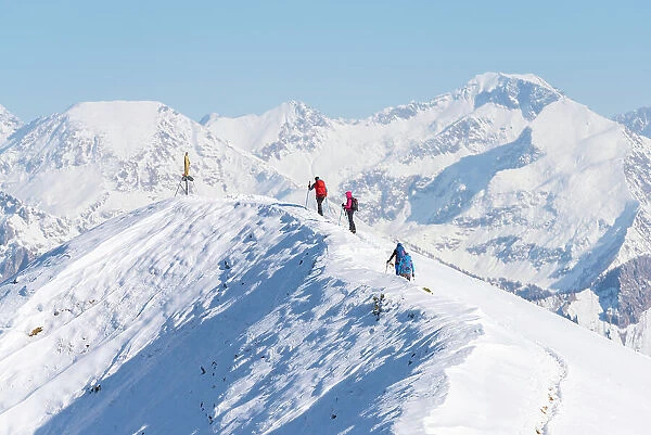 Alpinists on top of Pizzo Baciamorti, Taleggio valley, Val Brembana, Orobie alps, Lombardy Italian alps, Italy