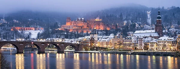Alte Brucke (Old Bridge) and castle in winter along the Neckar river, Heidelberg
