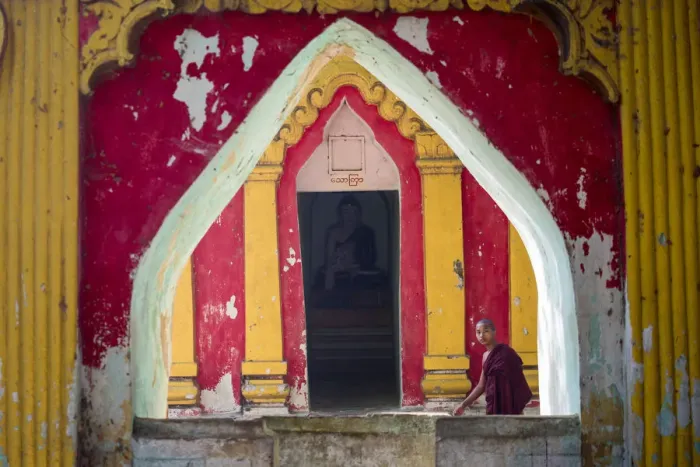 Framed Print : Amarapura, Mandalay region, Myanmar. Monk through the window of a colorful pagoda Framed Print : Amarapura, Mandalay region, Myanmar. Monk through the window of a colorful pagoda