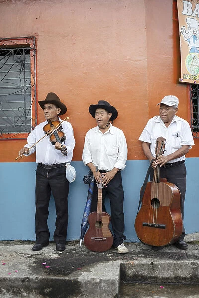 Americas, Central America, El Salvador, mariachi musicians in a a village street
