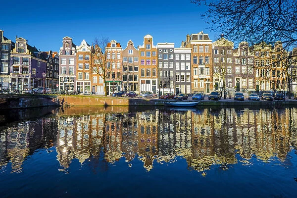 Amsterdam, Netherlands, Europe. Traditional old buildings reflected in the canal