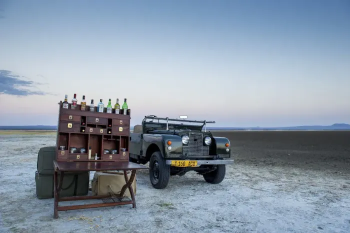 Framed Print : Ancient landrover and sundowner table on salt pan Framed Print : Ancient landrover and sundowner table on salt pan
