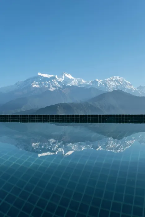 Framed Print : Annapurna mountain range reflected in hotel pool at Sarangkot near Pokhara, Annapurna Region, Gandaki Province, Nepalswimming pool Framed Print : Annapurna mountain range reflected in hotel pool at Sarangkot near Pokhara, Annapurna Region, Gandaki Province, Nepalswimming pool