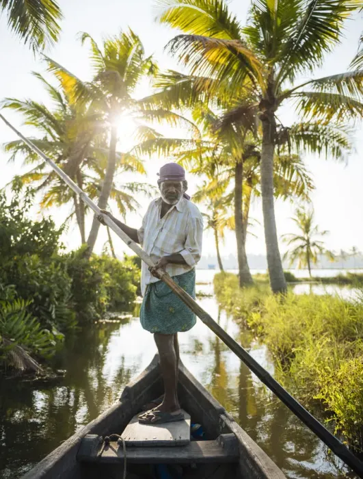 Framed Print : Anthony the boatman guiding the vessel through Keralan backwaters near North Paravoor Framed Print : Anthony the boatman guiding the vessel through Keralan backwaters near North Paravoor
