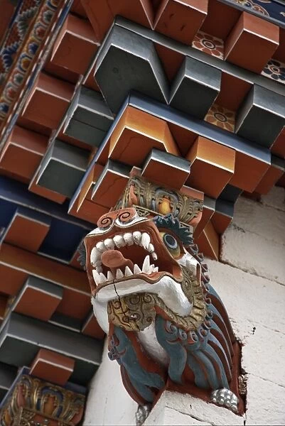 The architectural corner detail of the roof of a new temple near Kurjey Lhakhang with a carving of a dragon at its base. Bhutan is known as The Land of Dragons