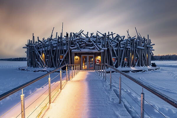Arctic Bath Hotel and snowy walkway on frozen river Lule, Harads, Lapland, Sweden