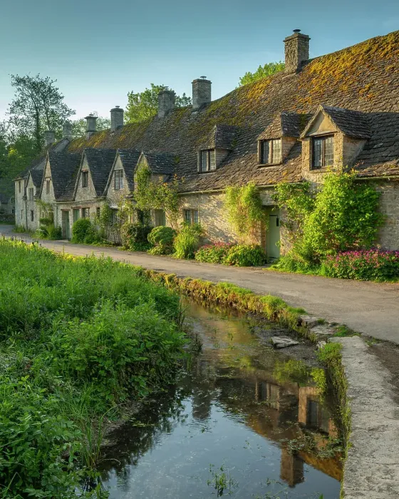 Framed Print : Arlington Row cottages in the pretty Cotswold village of Bibury, Gloucestershire, England. Spring (May) 2019 Framed Print : Arlington Row cottages in the pretty Cotswold village of Bibury, Gloucestershire, England. Spring (May) 2019