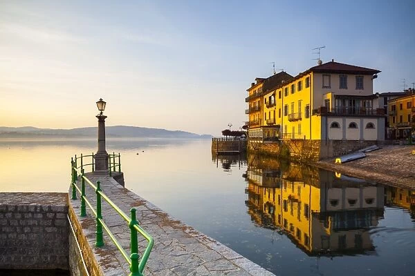 Aronas Picturesque lake-front illuminated at sunrise, Arona, Lake Maggiore, Piedmont