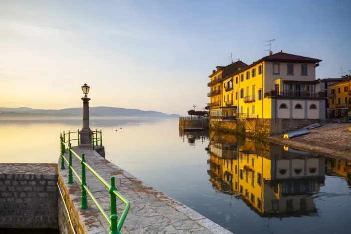 Framed Print : Aronas Picturesque lake-front illuminated at sunrise, Arona, Lake Maggiore, Piedmont Framed Print : Aronas Picturesque lake-front illuminated at sunrise, Arona, Lake Maggiore, Piedmont