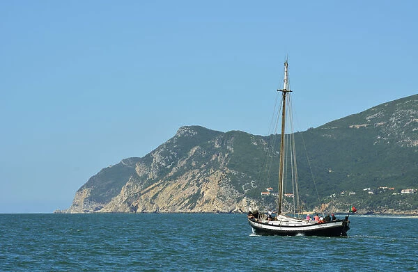 Arrabida Natural Park and a traditional boat from the Sado river. Portugal