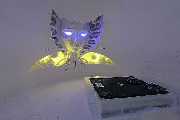 Artistic ice sculptures in shape of an alien face in a hotel suite, Lainio Snow Village, Kittila, Lapland, Finland