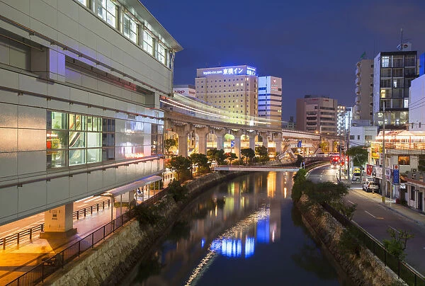 Asahibashi monorail station and downtown Naha at dusk, Okinawa, Japan