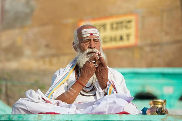 Asia, India, Uttar Pradesh, Varanasi district. Sadhu praying