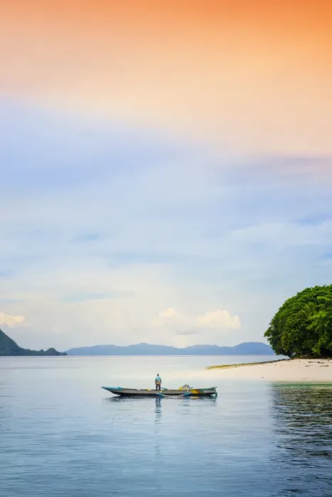 Framed Print : Asia, Indonesia, Spice Islands, Ambon, Malona Island, a local fisherman in front of a Framed Print : Asia, Indonesia, Spice Islands, Ambon, Malona Island, a local fisherman in front of a