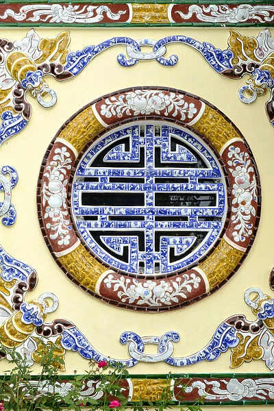 Asia, South East Asia, Vietnam; Hue. exterior window decoration on a Vietnamese temple