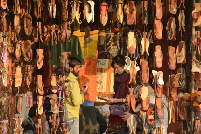 Framed Print : Asian woman buying shoes in market, Jaipur, India, Asia Framed Print : Asian woman buying shoes in market, Jaipur, India, Asia