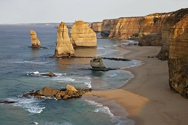 Australia, Victoria. Some of the Twelve Apostles standing in shallow water