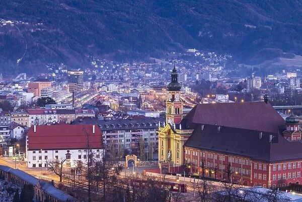 Austria, Tyrol, Innsbruck, elevated view of the Wilten Abbey Church, dawn, winter