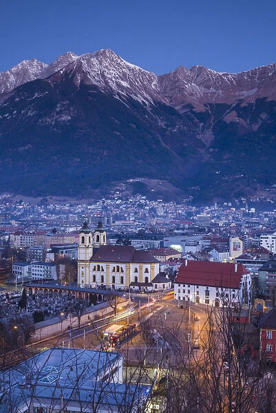 Austria, Tyrol, Innsbruck, elevated view of the Wilten Basilica, dawn, winter